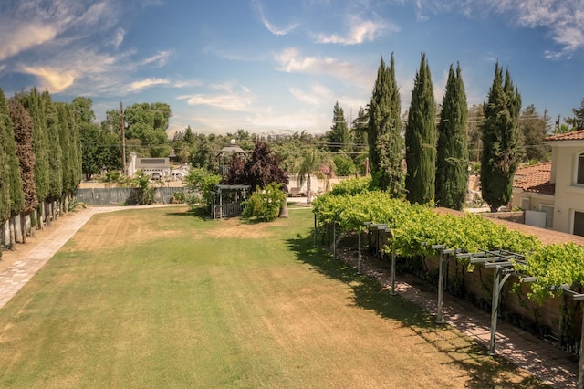 8067 E Belmont Ave, Fresno, CA 93737 - view of green lawn featuring a garden