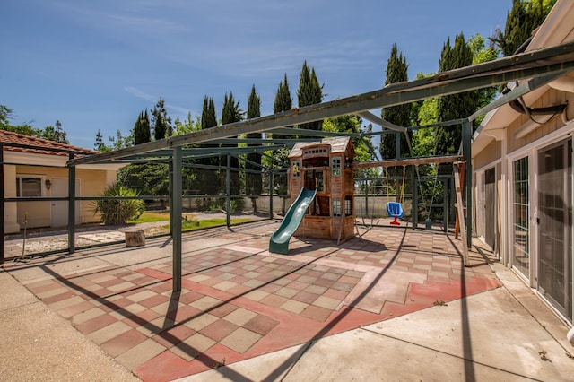 8067 E Belmont Ave, Fresno, CA 93737 - view of patio / terrace featuring a playground and fence