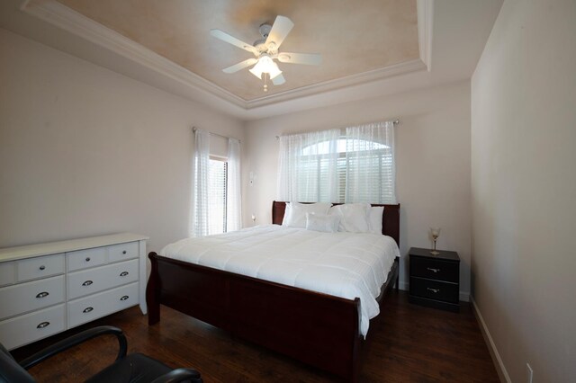 8067 E Belmont Ave, Fresno, CA 93737 - bedroom with a raised ceiling, dark wood finished floors, ceiling fan, baseboards, and crown molding