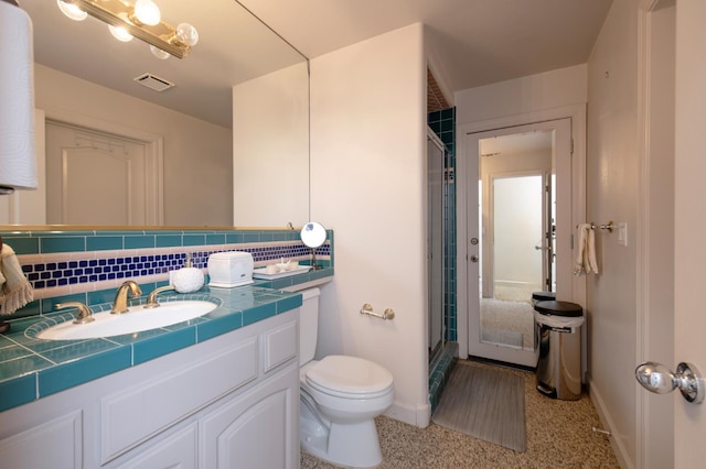 8067 E Belmont Ave, Fresno, CA 93737 - full bathroom with a shower stall, baseboards, vanity, and toilet