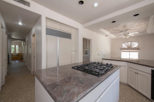 8067 E Belmont Ave, Fresno, CA 93737 - kitchen featuring black gas cooktop, paneled fridge, arched walkways, recessed lighting, and healthy amount of natural light