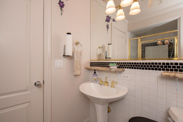 8067 E Belmont Ave, Fresno, CA 93737 - bathroom with a shower stall, toilet, ornamental molding, and decorative backsplash