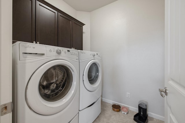 6326 W Sweet Ct, Visalia, CA 93291 - laundry area featuring cabinet space, washing machine and dryer, baseboards, and light tile patterned floors