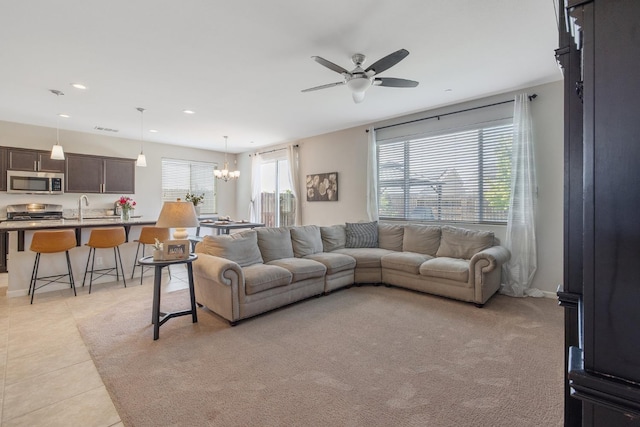 6326 W Sweet Ct, Visalia, CA 93291 - living area featuring a ceiling fan, a chandelier, recessed lighting, and light tile patterned floors