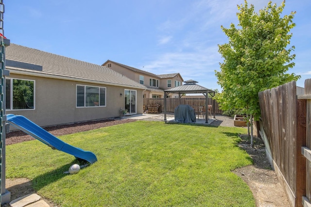 6326 W Sweet Ct, Visalia, CA 93291 - rear view of house with a gazebo, a patio area, stucco siding, and a tiled roof