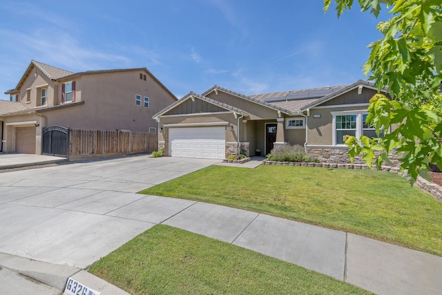 6326 W Sweet Ct, Visalia, CA 93291 - view of front facade featuring stucco siding, an attached garage, driveway, roof mounted solar panels, and a tiled roof