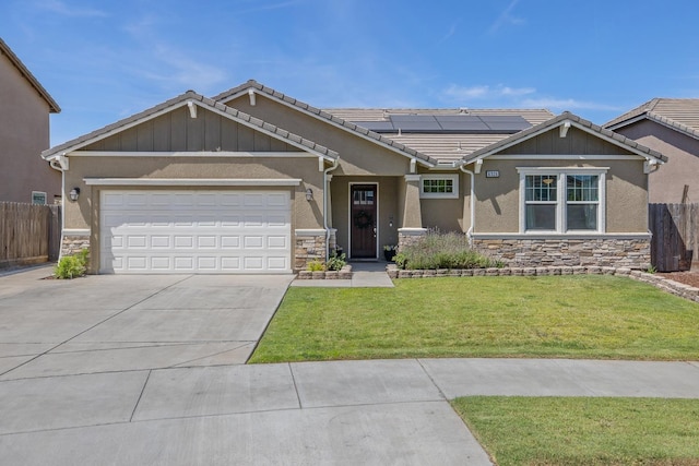 6326 W Sweet Ct, Visalia, CA 93291 - craftsman-style house featuring stone siding, concrete driveway, solar panels, and stucco siding