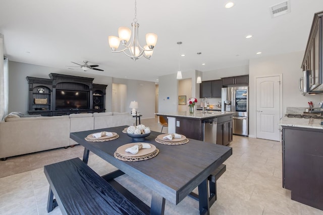 6326 W Sweet Ct, Visalia, CA 93291 - dining area featuring ceiling fan, a chandelier, recessed lighting, and light tile patterned floors