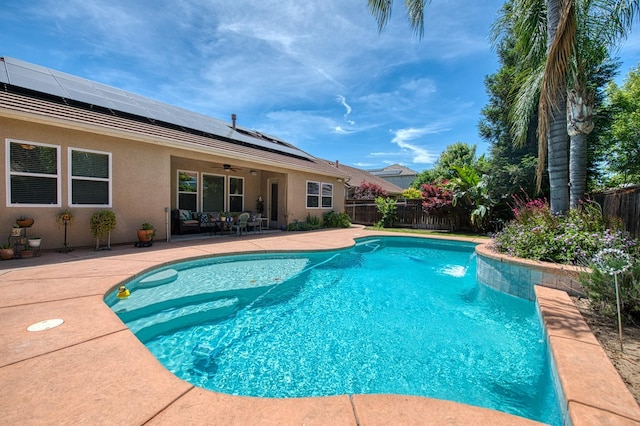 view of swimming pool featuring ceiling fan, a fenced backyard, and a patio