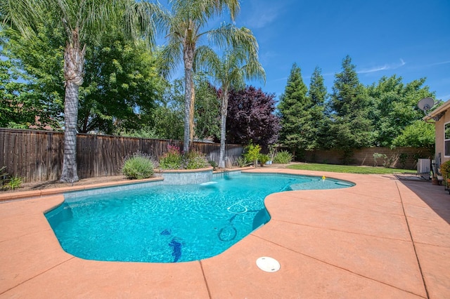 view of swimming pool with a patio and a fenced backyard