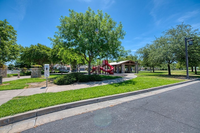 obstructed view of property with a front yard