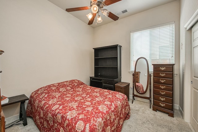 bedroom with light colored carpet, baseboards, and ceiling fan