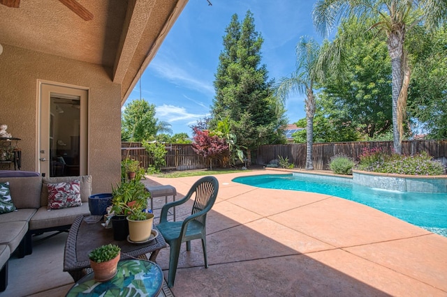 view of pool featuring a patio, a fenced backyard, and an outdoor living space