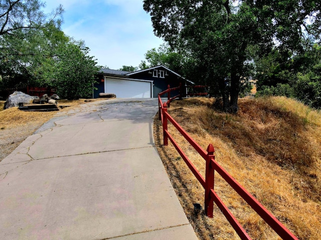 41549 Long Hollow Dr, Coarsegold, CA 93614 - view of front of home with concrete driveway and an attached garage