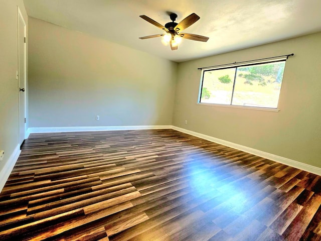 41549 Long Hollow Dr, Coarsegold, CA 93614 - empty room featuring dark wood finished floors, ceiling fan, and baseboards