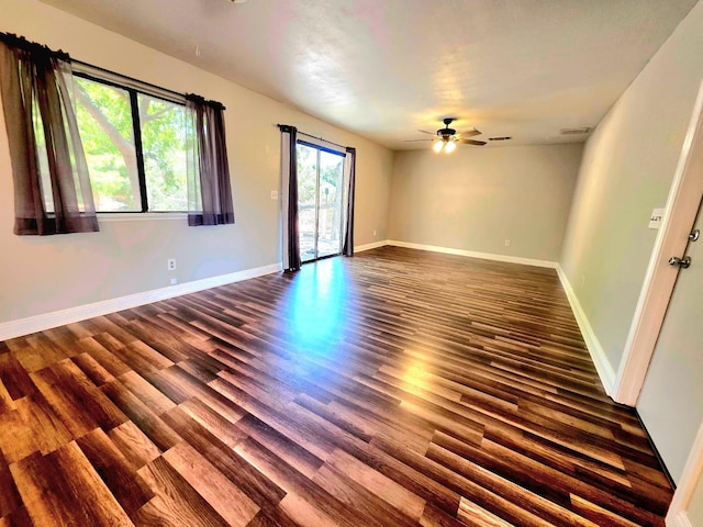 41549 Long Hollow Dr, Coarsegold, CA 93614 - unfurnished room with dark wood finished floors, ceiling fan, and baseboards