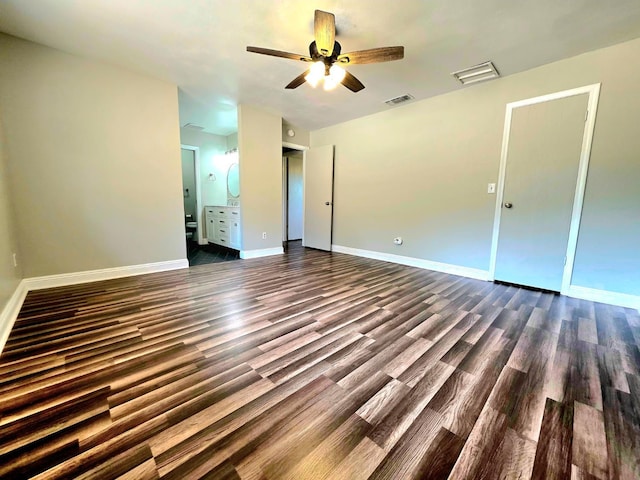 41549 Long Hollow Dr, Coarsegold, CA 93614 - unfurnished bedroom featuring dark wood-style flooring, ensuite bathroom, baseboards, and ceiling fan
