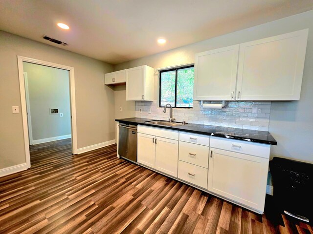 41549 Long Hollow Dr, Coarsegold, CA 93614 - kitchen featuring dishwasher, a sink, dark countertops, white cabinets, and tasteful backsplash