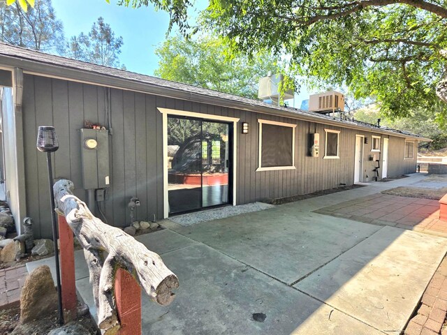 41549 Long Hollow Dr, Coarsegold, CA 93614 - back of house with a patio and roof with shingles