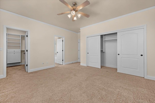 unfurnished bedroom featuring ornamental molding, carpet, a closet, baseboards, and connected bathroom