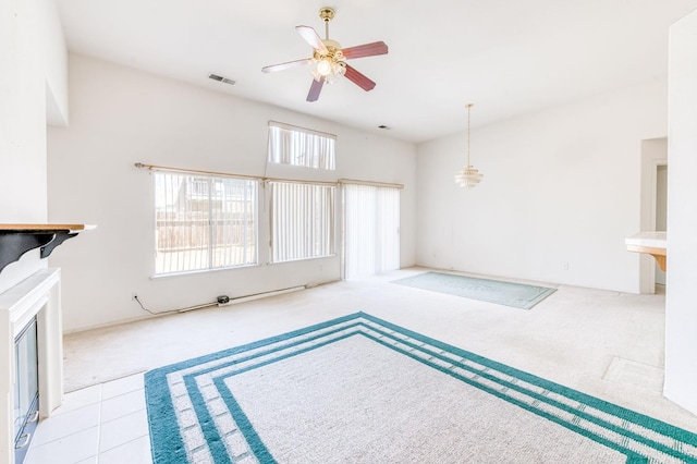 2670 N Katy Ave, Fresno, CA 93722 - unfurnished living room with carpet floors and ceiling fan