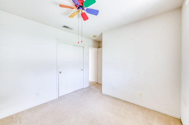2670 N Katy Ave, Fresno, CA 93722 - unfurnished bedroom featuring carpet flooring, a closet, and a ceiling fan