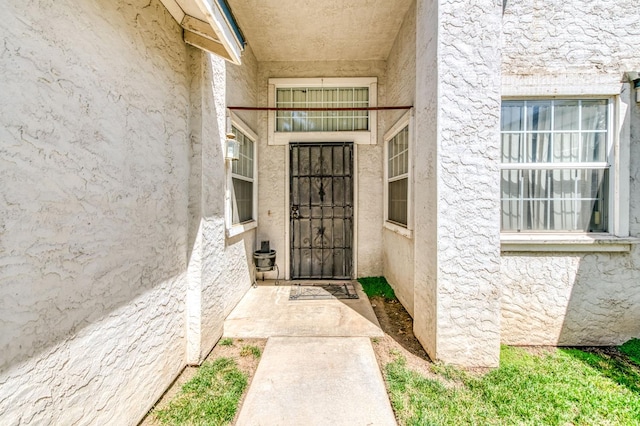 2670 N Katy Ave, Fresno, CA 93722 - doorway to property featuring stucco siding