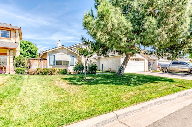 2670 N Katy Ave, Fresno, CA 93722 - view of front of home with driveway and a garage