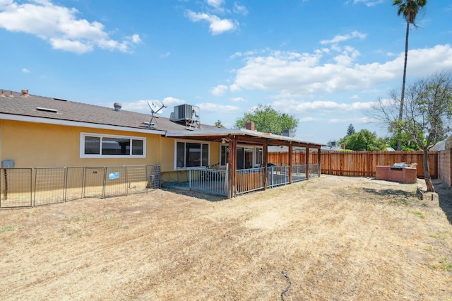 3752 E Saginaw Way, Fresno, CA 93726 - back of property with central AC, a fenced backyard, a patio area, and stucco siding