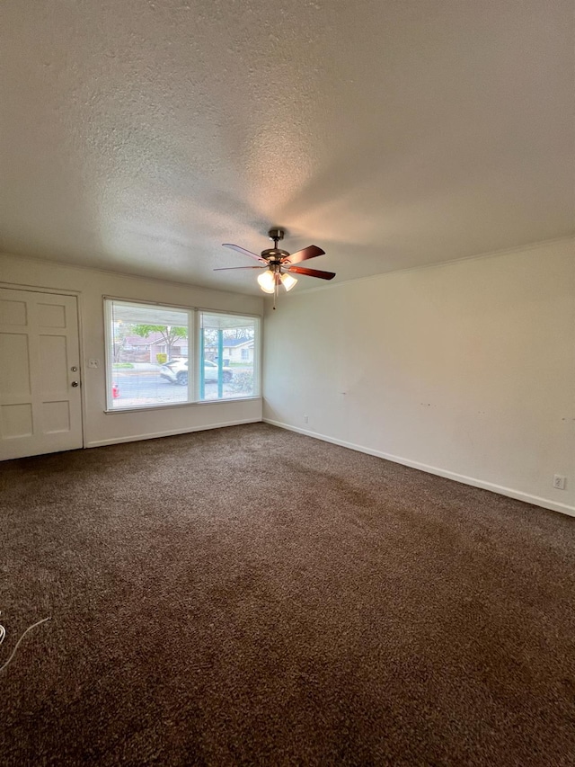 1402 E Shields Ave, Fresno, CA 93704 - carpeted spare room with a ceiling fan, a textured ceiling, and baseboards