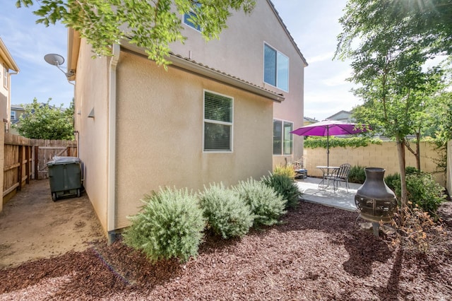 3507 Significant Way, Clovis, CA 93619 - view of property exterior with a patio, a fenced backyard, and stucco siding