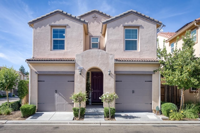 3507 Significant Way, Clovis, CA 93619 - mediterranean / spanish house featuring an attached garage, a tile roof, stucco siding, and fence