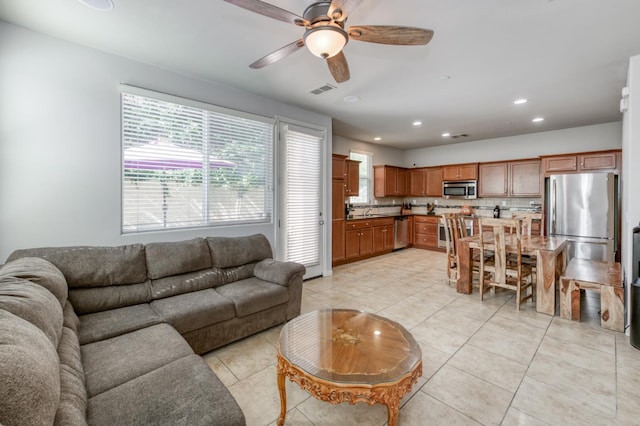 3507 Significant Way, Clovis, CA 93619 - living area with ceiling fan, light tile patterned floors, and recessed lighting
