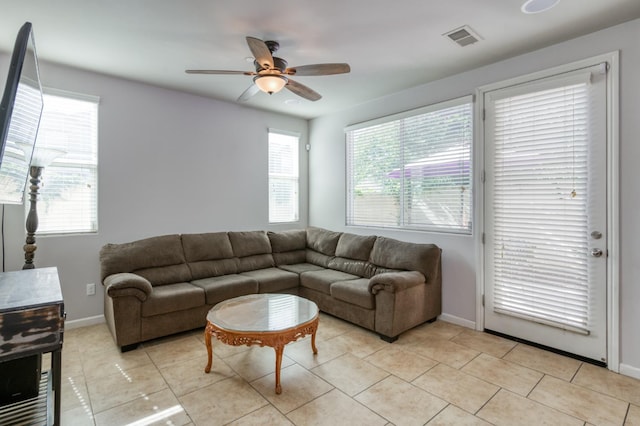 3507 Significant Way, Clovis, CA 93619 - living area featuring a ceiling fan, baseboards, and light tile patterned floors