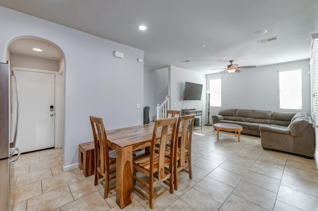 3507 Significant Way, Clovis, CA 93619 - dining area with stairs, a ceiling fan, light tile patterned floors, arched walkways, and recessed lighting