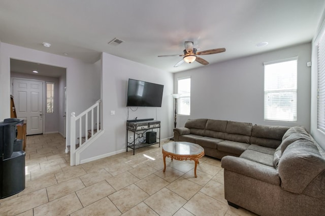 3507 Significant Way, Clovis, CA 93619 - living area featuring ceiling fan, stairs, light tile patterned floors, and baseboards