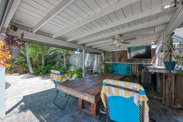 view of patio with outdoor dining area and ceiling fan