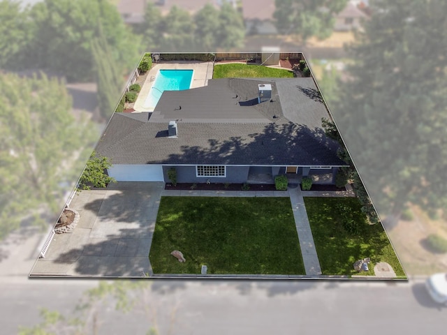 aerial view of property and surrounding area with a pool area and property parcel outlined