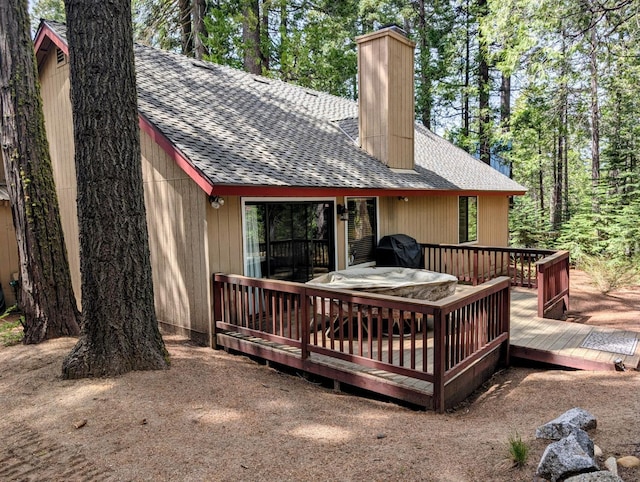 41016 Woodridge Ln, Shaver Lake, CA 93664 - back of house featuring roof with shingles, a chimney, and a deck
