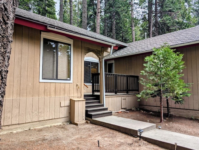 41016 Woodridge Ln, Shaver Lake, CA 93664 - property entrance featuring a shingled roof