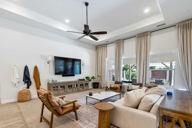 2506 20th Ave, Kingsburg, CA 93631 - living area featuring wood finished floors, a ceiling fan, crown molding, a tray ceiling, and recessed lighting