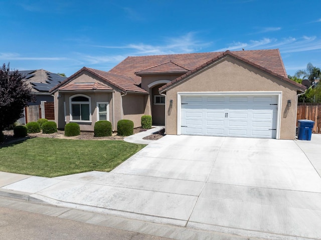 2506 20th Ave, Kingsburg, CA 93631 - view of front of home with concrete driveway, a garage, a tile roof, and stucco siding