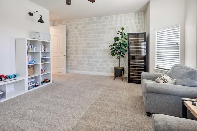 2506 20th Ave, Kingsburg, CA 93631 - sitting room with wallpapered walls, carpet floors, a ceiling fan, wine cooler, and baseboards