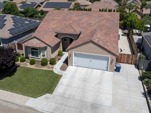 2506 20th Ave, Kingsburg, CA 93631 - view of front of property with concrete driveway, a garage, a tile roof, and stucco siding