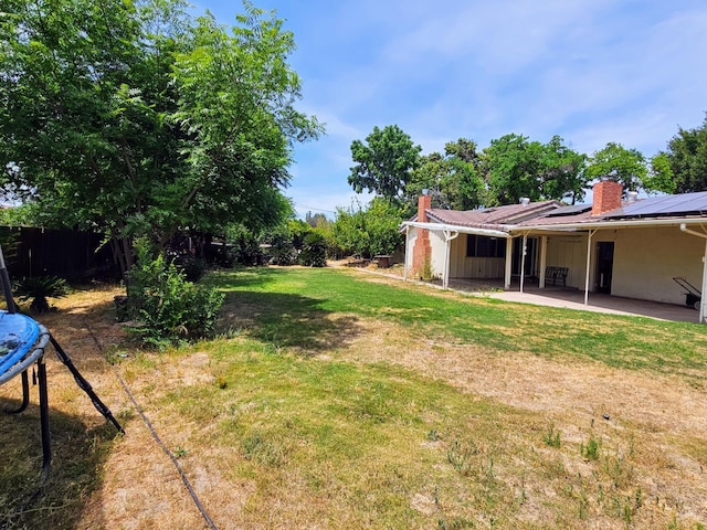 5850 E Parkside Dr, Fresno, CA 93727 - view of yard featuring a patio area and a trampoline