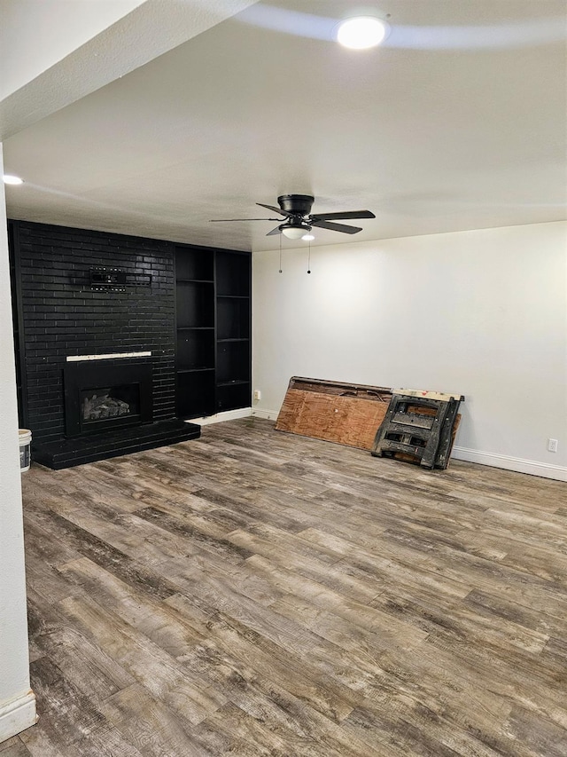 5850 E Parkside Dr, Fresno, CA 93727 - unfurnished living room featuring baseboards, wood finished floors, and a ceiling fan