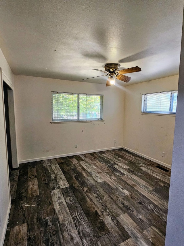 5850 E Parkside Dr, Fresno, CA 93727 - empty room with wood finished floors, plenty of natural light, ceiling fan, and a textured ceiling