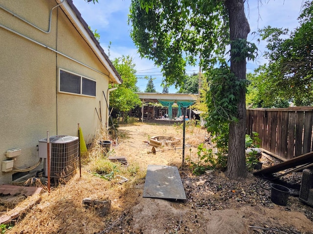 5850 E Parkside Dr, Fresno, CA 93727 - view of yard featuring central AC and fence