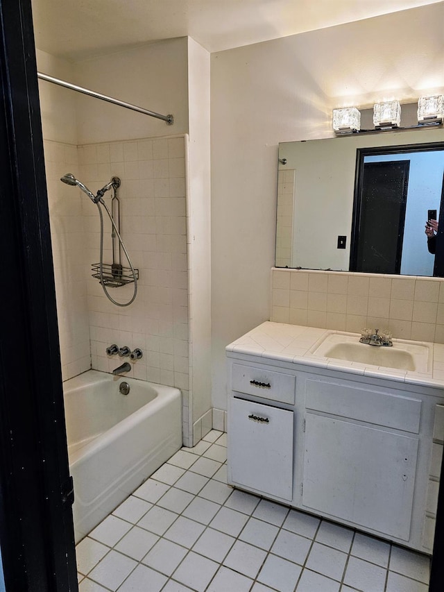 5850 E Parkside Dr, Fresno, CA 93727 - bathroom with tile patterned floors, vanity, and shower / washtub combination