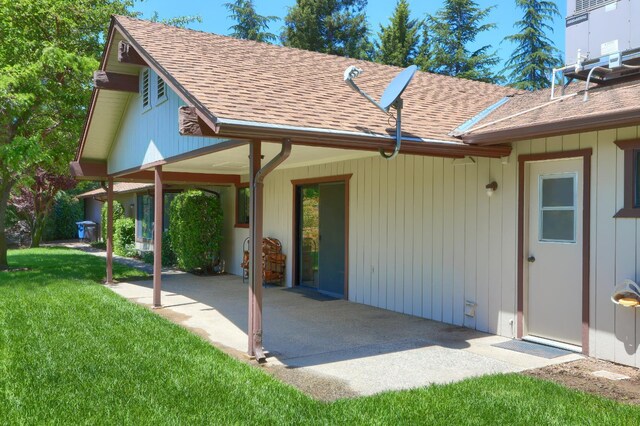 42177 Lone Olive Ln, Ahwahnee, CA 93601 - back of house featuring a patio area, a yard, and roof with shingles